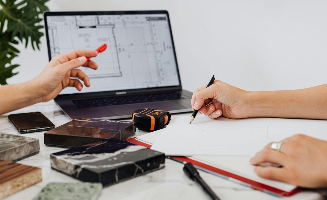 A home renovation contractor reviewing a project with a client